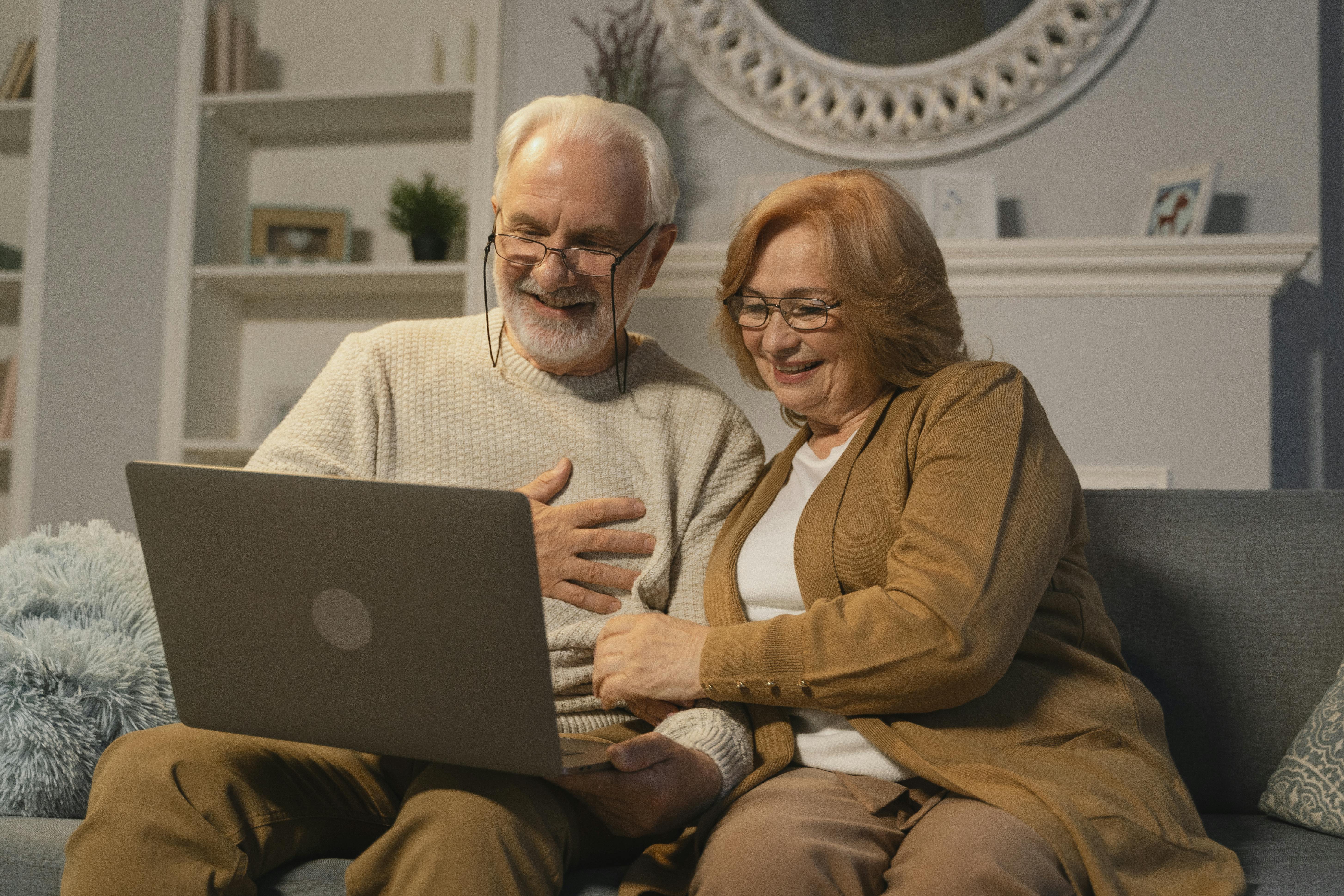 Couple reviewing their retirement plan on laptop